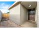A side view of a home featuring a dark brown front door and neutral colored siding at 4922 W Coolidge St, Phoenix, AZ 85031