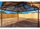 Underneath the gazebo looking out at the new wood fence and sunny skies at 4922 W Coolidge St, Phoenix, AZ 85031