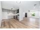 Open-concept kitchen featuring gray cabinets, stainless steel appliances, and wood-look flooring at 4922 W Coolidge St, Phoenix, AZ 85031