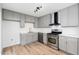 Updated kitchen featuring gray cabinets, stainless steel appliances, and modern countertops at 4922 W Coolidge St, Phoenix, AZ 85031