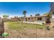 Backyard view of lawn, patio and home at 5159 W Vernon Ave, Phoenix, AZ 85035
