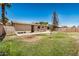 Backyard view of lawn, patio and home at 5159 W Vernon Ave, Phoenix, AZ 85035