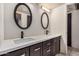 Bathroom with double sinks, stylish mirrors and a modern countertop at 5159 W Vernon Ave, Phoenix, AZ 85035
