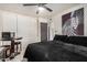 Bedroom featuring a queen bed, zebra art, table, and ceiling fan, enhancing the room's appeal at 5159 W Vernon Ave, Phoenix, AZ 85035