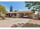 Cozy single-story home with covered entry, carport, and well-lit driveway at 5159 W Vernon Ave, Phoenix, AZ 85035