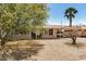 Attractive single-story home featuring desert landscaping, covered entrance and convenient carport at 5159 W Vernon Ave, Phoenix, AZ 85035