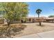 Beautiful single-story home with desert landscape, welcoming porch, and attached carport at 5159 W Vernon Ave, Phoenix, AZ 85035
