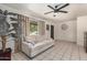 Bright living room with tile floors, ceiling fan, and comfortable sofa at 5159 W Vernon Ave, Phoenix, AZ 85035
