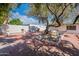 Tranquil backyard with a large tree, brick accents, and a serene atmosphere at 5539 E Dahlia Dr, Scottsdale, AZ 85254