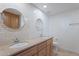 Bathroom featuring double sinks, granite countertop and subway-tile backsplash at 5539 E Dahlia Dr, Scottsdale, AZ 85254