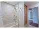 Bathroom with bathtub, shower and custom tiled wall at 5539 E Dahlia Dr, Scottsdale, AZ 85254