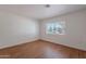 Bright bedroom featuring plank floors and a window at 5539 E Dahlia Dr, Scottsdale, AZ 85254
