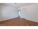 Bright bedroom featuring plank floors, a built-in closet and a door at 5539 E Dahlia Dr, Scottsdale, AZ 85254