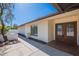 Inviting front entrance featuring a brick exterior, double doors, and a well-lit porch area at 5539 E Dahlia Dr, Scottsdale, AZ 85254