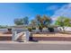 Charming single-story home with well-maintained landscaping and a classic brick facade under a blue sky at 5539 E Dahlia Dr, Scottsdale, AZ 85254