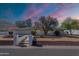 Charming single story home featuring tidy front yard and vibrant twilight sky at 5539 E Dahlia Dr, Scottsdale, AZ 85254