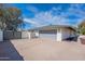 Spacious two-car garage with a neutral door and ample driveway space surrounded by a secure fence at 5539 E Dahlia Dr, Scottsdale, AZ 85254