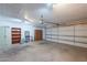 Spacious garage with cabinets and shelving providing ample storage at 5539 E Dahlia Dr, Scottsdale, AZ 85254