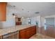 Open layout showcasing a kitchen island with granite countertop and stainless steel dishwasher at 5539 E Dahlia Dr, Scottsdale, AZ 85254