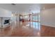 Expansive living area featuring a modern fireplace, wood floors, and an open layout to the kitchen at 5539 E Dahlia Dr, Scottsdale, AZ 85254