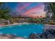 Backyard pool area surrounded by desert foliage and comfortable lounge chairs at 5539 E Dahlia Dr, Scottsdale, AZ 85254