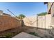 Enclosed backyard has a clothesline and a gate with a 'No Smoking' sign at 6902 W Devonshire Ave # 1280, Phoenix, AZ 85033