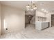 Bright dining room with tile floors, a modern chandelier, open to the kitchen area at 6902 W Devonshire Ave # 1280, Phoenix, AZ 85033
