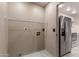 This laundry room is spacious and has easy access to the kitchen with stainless steel refrigerator at 6902 W Devonshire Ave # 1280, Phoenix, AZ 85033
