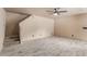 Spacious living room with tile floors, a ceiling fan, and access to the stairs at 6902 W Devonshire Ave # 1280, Phoenix, AZ 85033