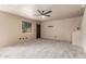 Spacious living room with tile floors, a ceiling fan, and a coat rack at 6902 W Devonshire Ave # 1280, Phoenix, AZ 85033