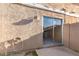 Enclosed patio with a sliding glass door and a garden hose at 6902 W Devonshire Ave # 1280, Phoenix, AZ 85033