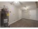 A partially finished basement includes durable flooring, water heater, and connections for appliances at 717 W Chilton St, Chandler, AZ 85225