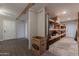 The basement features practical storage shelves, durable flooring, and easy access to other areas at 717 W Chilton St, Chandler, AZ 85225
