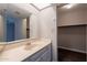Bathroom featuring marble countertop vanity with views to closet and bedroom at 717 W Chilton St, Chandler, AZ 85225