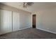 Comfortable bedroom featuring carpeted floors and double door closet at 717 W Chilton St, Chandler, AZ 85225