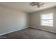 Cozy bedroom featuring carpeted floors and a well-lit window with exterior views at 717 W Chilton St, Chandler, AZ 85225