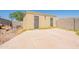View of the detached garage with cement driveway and side yard at 717 W Chilton St, Chandler, AZ 85225
