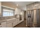 Updated kitchen features stainless steel appliances, a farmhouse sink and granite countertops at 717 W Chilton St, Chandler, AZ 85225