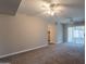 Expansive living room with new carpet, two ceiling fans, and access to sunroom at 717 W Chilton St, Chandler, AZ 85225