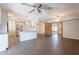 Open-concept living area with wood-look flooring seamlessly connected to the modern kitchen at 717 W Chilton St, Chandler, AZ 85225
