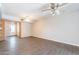 Bright and spacious living room featuring a ceiling fan and modern flooring at 717 W Chilton St, Chandler, AZ 85225