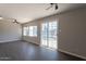 Bright living room with dark wood floors, and sliding glass doors offering plenty of natural light at 717 W Chilton St, Chandler, AZ 85225
