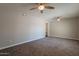 Bright living room featuring carpeted floors, neutral walls, recessed lighting, and a built-in shelf at 717 W Chilton St, Chandler, AZ 85225