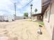 Large backyard featuring mature trees, a covered patio, and a dirt yard at 7202 N 36Th Ave, Phoenix, AZ 85051