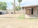 Spacious backyard with a covered patio area, mature trees, and block wall fencing at 7202 N 36Th Ave, Phoenix, AZ 85051