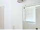 Bright bathroom features a decorative mirror, white tile, and modern lighting fixture at 7202 N 36Th Ave, Phoenix, AZ 85051