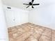 Bedroom featuring neutral tile floor, ceiling fan, and closet at 7202 N 36Th Ave, Phoenix, AZ 85051