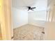 Clean bedroom with neutral tile floor and ceiling fan at 7202 N 36Th Ave, Phoenix, AZ 85051