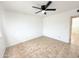 Spacious bedroom featuring neutral tile floor, white walls, and ceiling fan at 7202 N 36Th Ave, Phoenix, AZ 85051