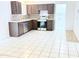 Traditional kitchen featuring stainless steel appliances and tiled countertops at 7202 N 36Th Ave, Phoenix, AZ 85051
